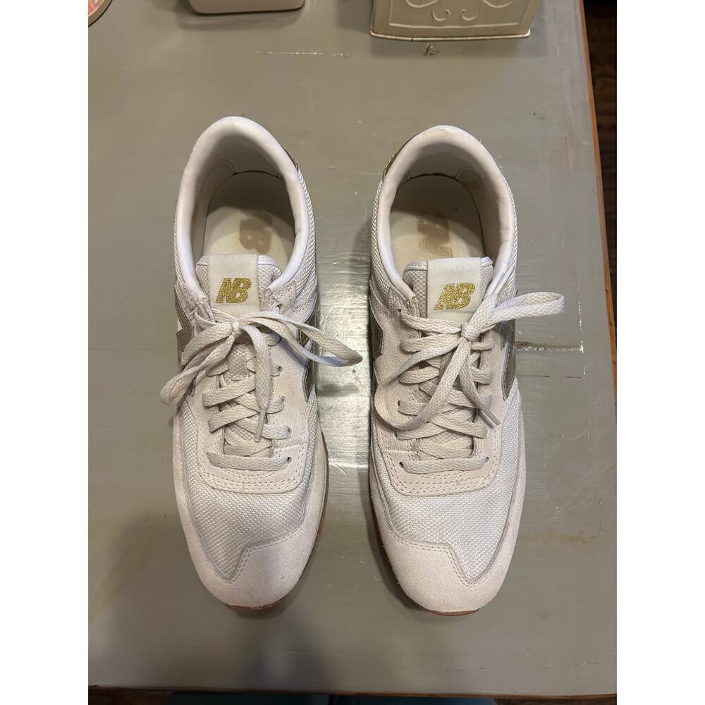 New Balance cream and gold sneakers casual glam